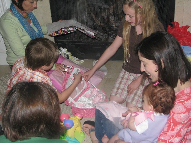 IMG_2645.JPG - My cousins Noah and Arienne helped me open the tea set that they got me.