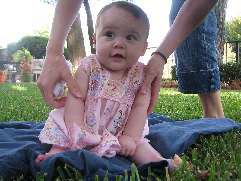 PinkDressMommyArrange.JPG - Here's me in a dress that Mommy & Daddy got on their honeymoon in Mexico. I'm finally big enough to wear it.