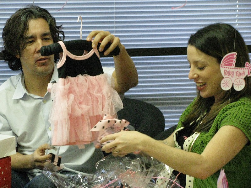 IMG_1547.JPG - Daddy checks out my cute ruffley frock. Mommy's holding the polkadot shoes that go with the dress.